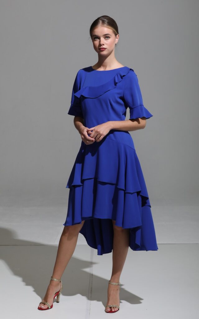 Heidi Higgins, an award-winning designer and businesswoman known for her impactful use of colour. Famous for her dress collections, she designs looks to take her clients from day to after dark